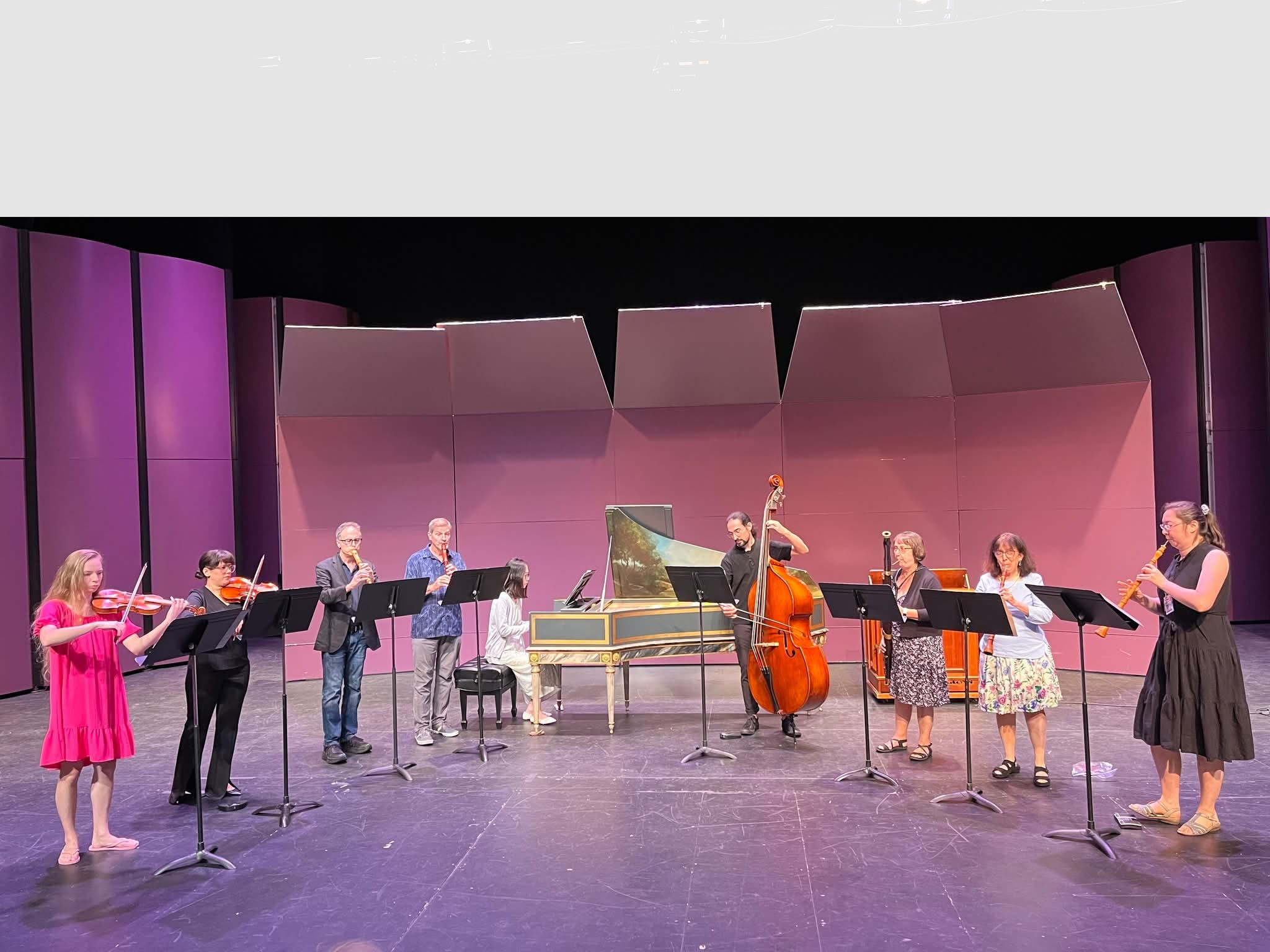 brightly dressed musicians with instruments